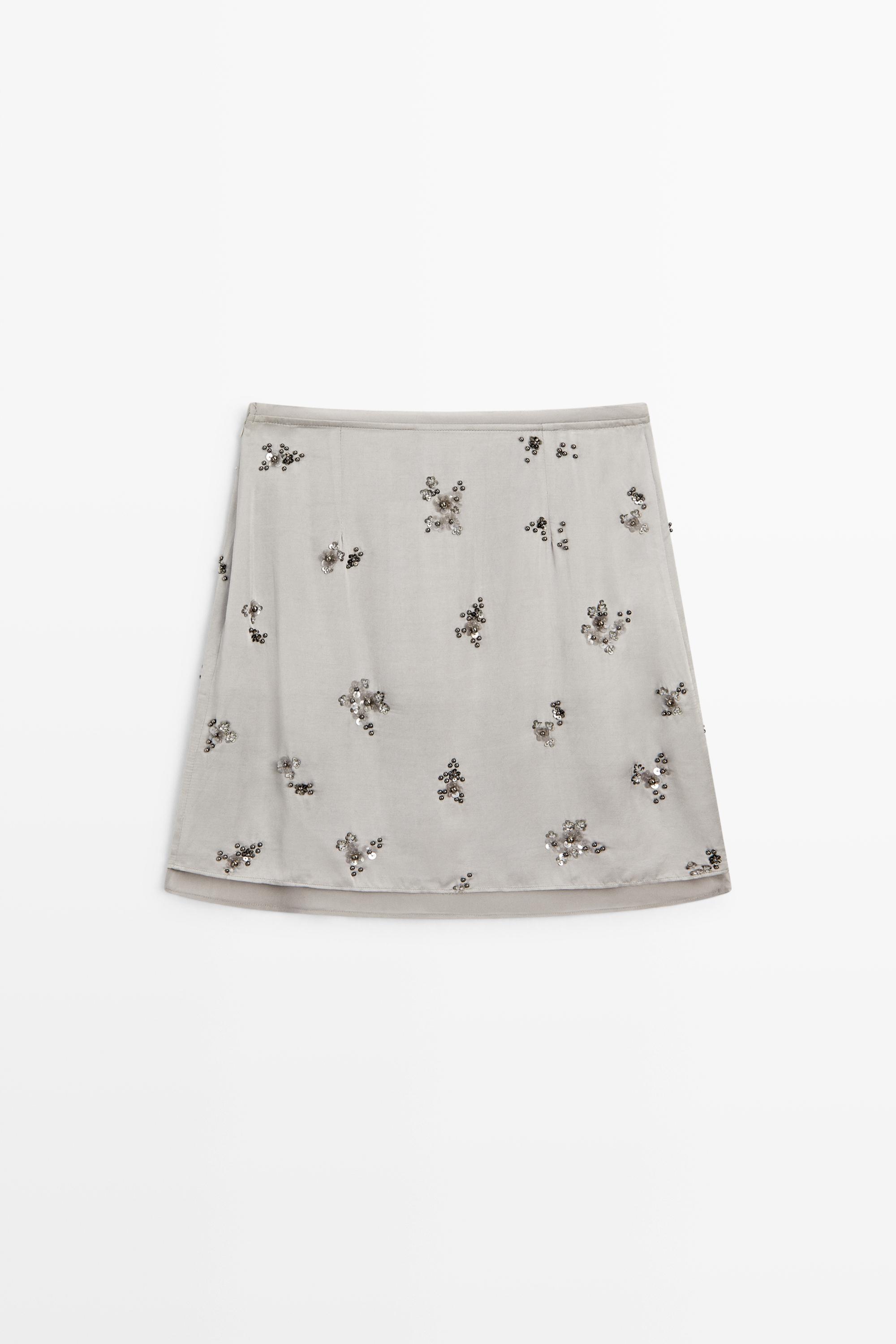 Mini skirt with beaded detail